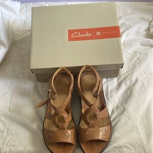Clark sandals, Beige in color never been used so cute on. Never been used brand